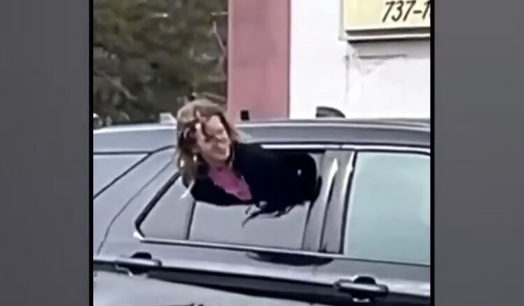 Woman Gets Out Of Tight Spot By Squeezing Through Half-Open Cop Car Window